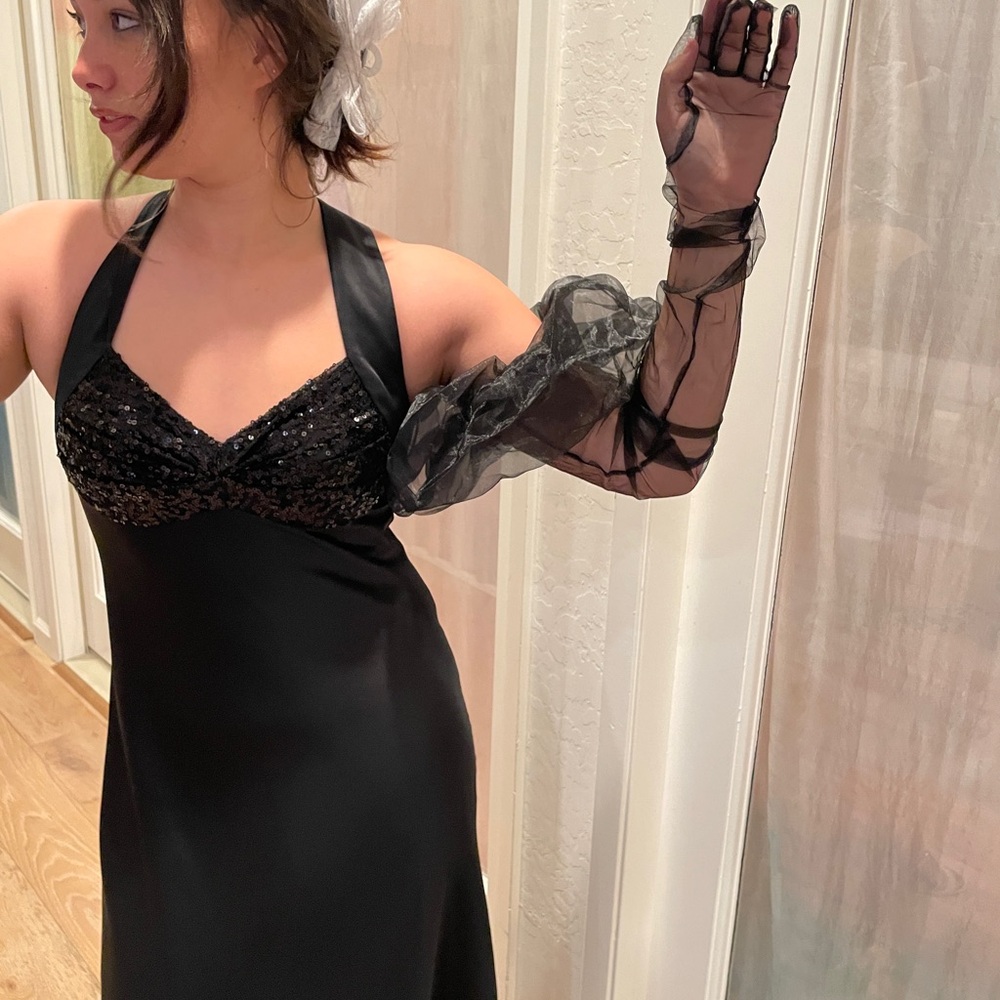 Elegant black sheer gloves with ruffled ends